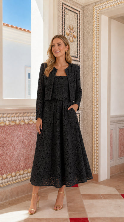 Woman wearing black lace crop jacket and midi dress set