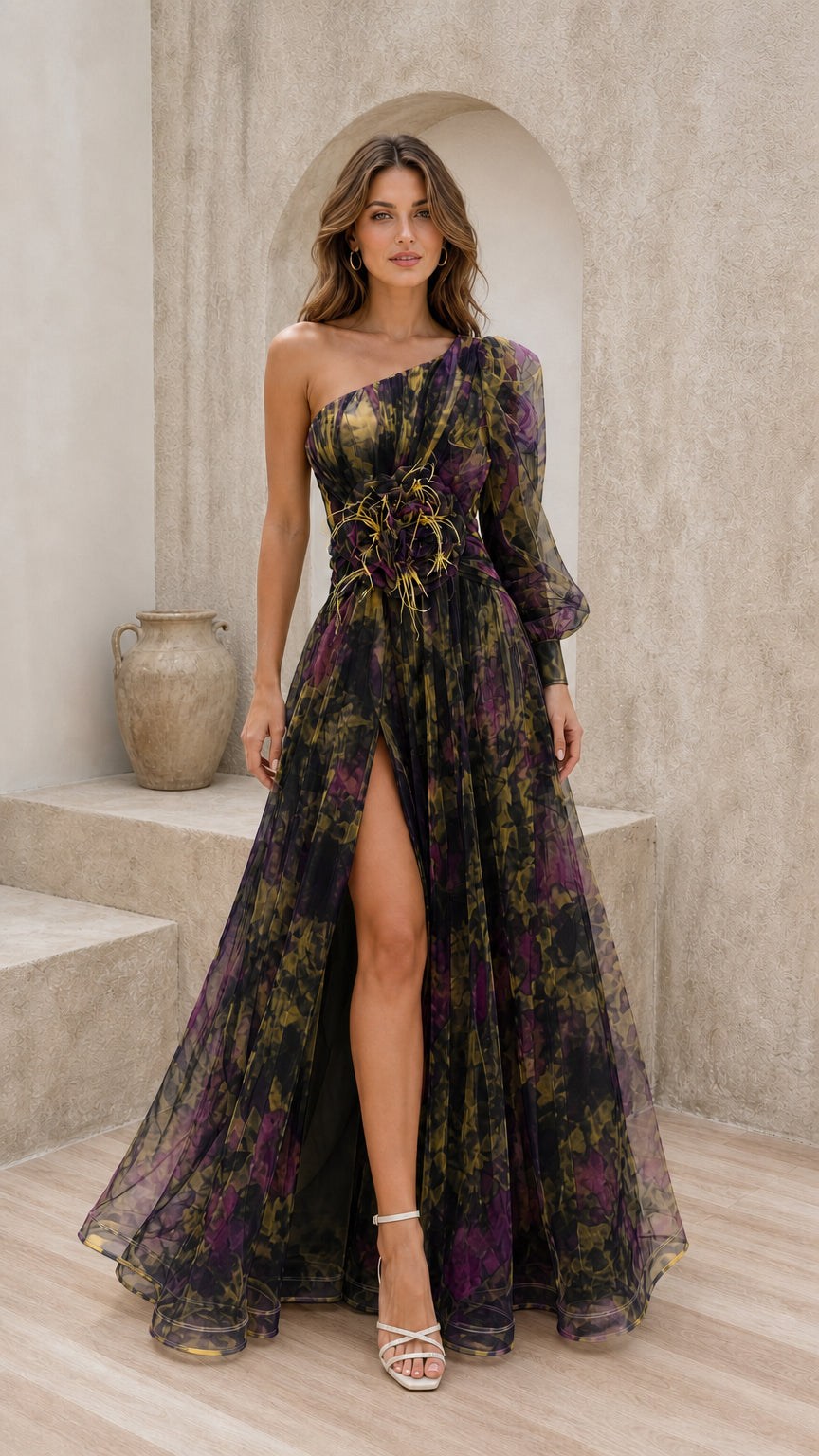 Front view of black multi evening gown with feather waist accent