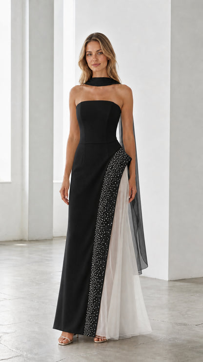 Black strapless evening gown with sheer white tulle side panel