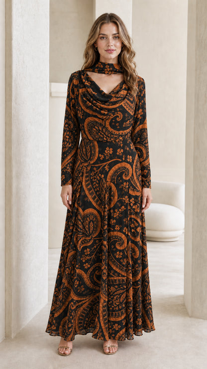 Model wearing black and brown paisley long-sleeve maxi dress