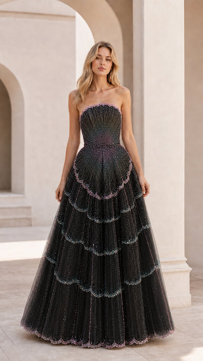 Front view of black strapless embellished ball gown