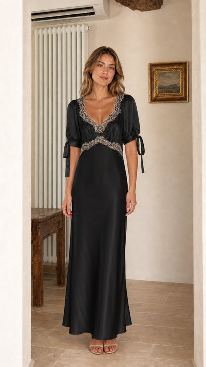 Front view of model wearing Black satin lace trim maxi dress