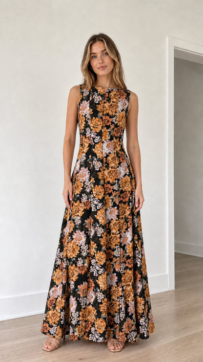 Woman wearing black floral print maxi dress