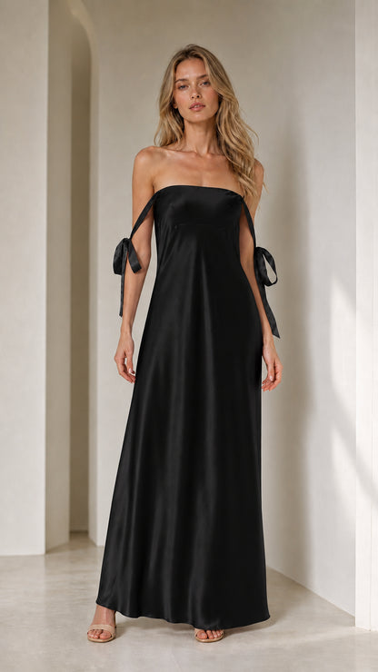 Model wearing black satin strapless maxi dress