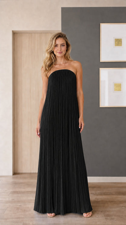 Model wearing black strapless pleated maxi dress