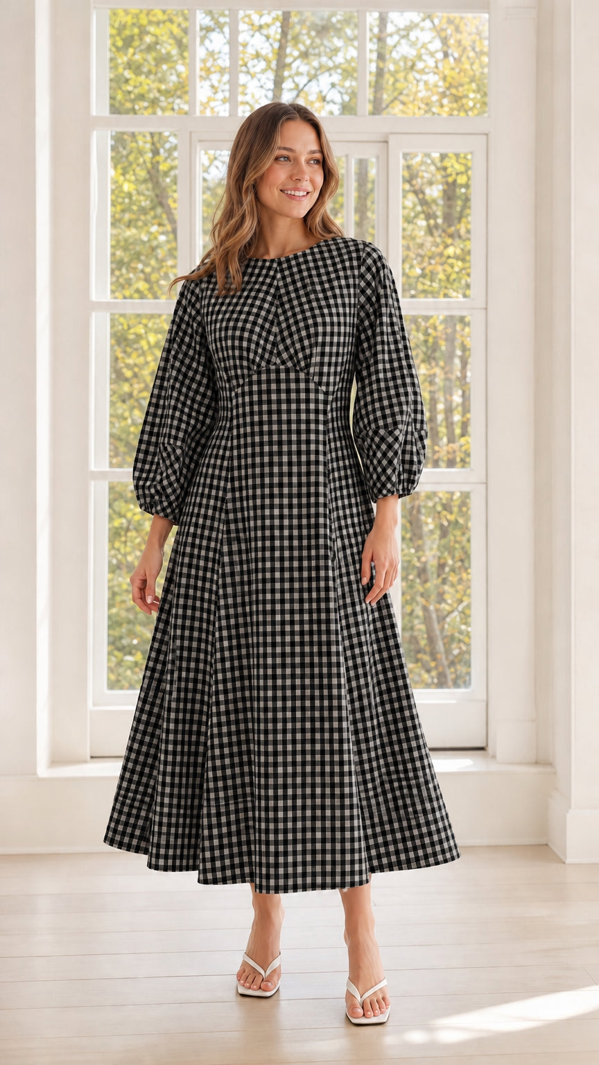 Woman wearing black gingham midi dress