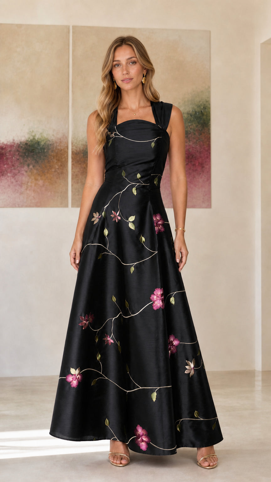 Model wearing black embroidered floral evening dress