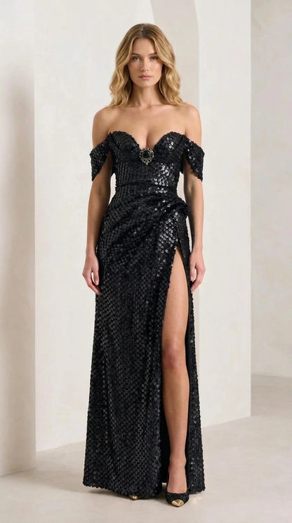 Front view of model wearing black sequin evening gown