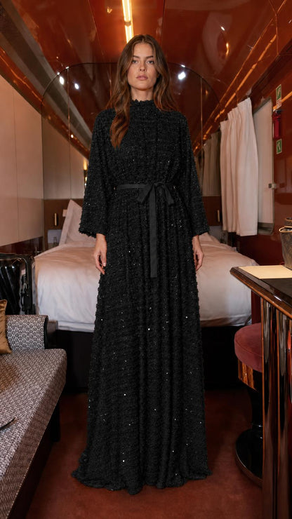 Front view of black textured sequin maxi dress