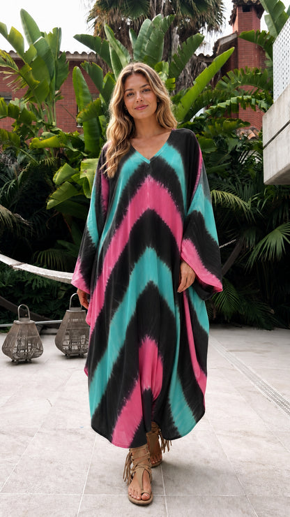 Model wearing black base multi-color chevron tie-dye kaftan