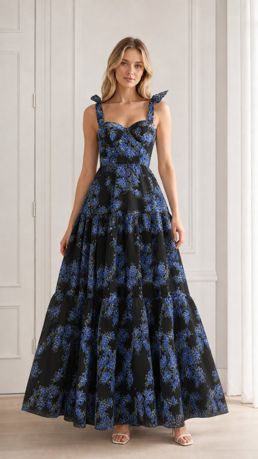 Model wearing black floral tiered maxi dress