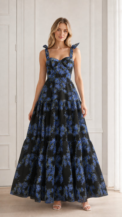 Model wearing black floral tiered maxi dress