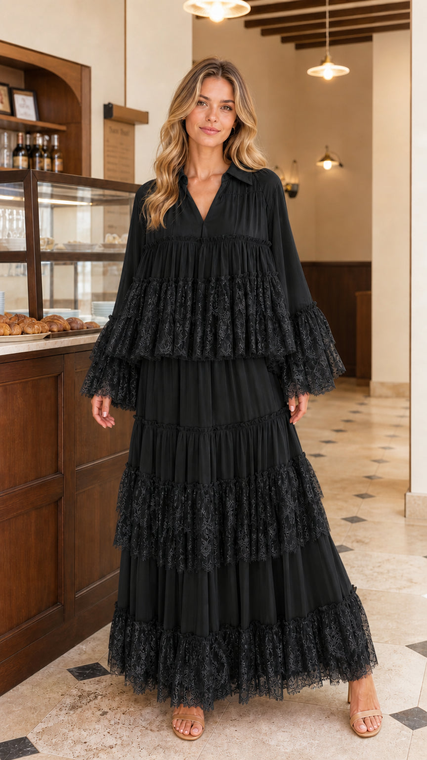Front view of model wearing black tiered lace maxi dress
