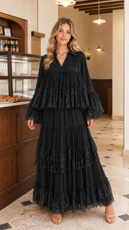 Front view of model wearing black tiered lace maxi dress