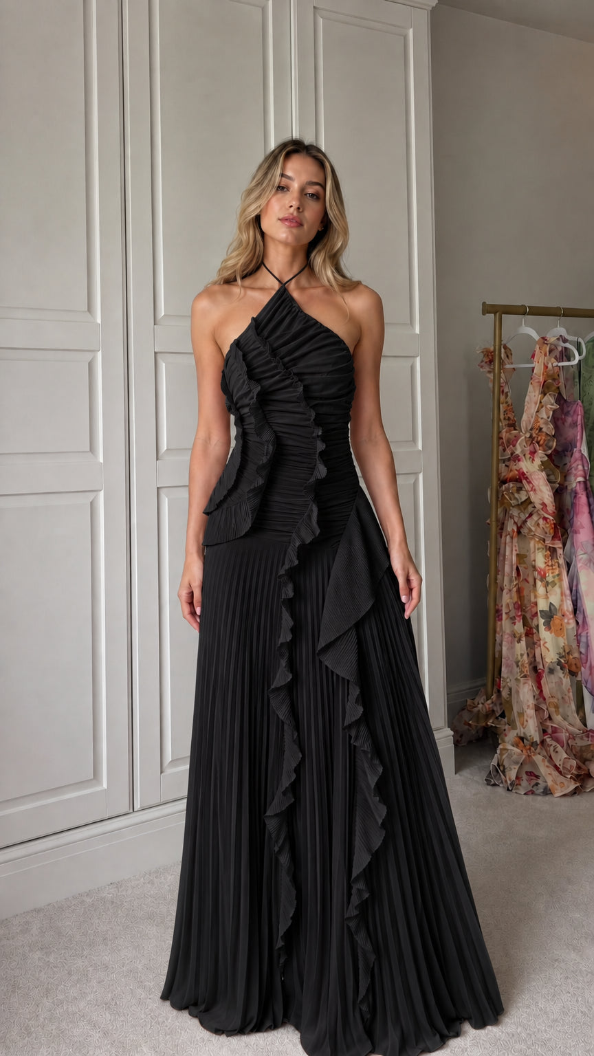 Front view of model wearing black halter neck pleated ruffle maxi dress