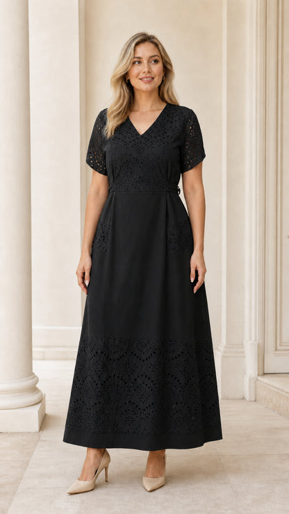 Full-length view of woman wearing black eyelet embroidered short sleeve maxi dress