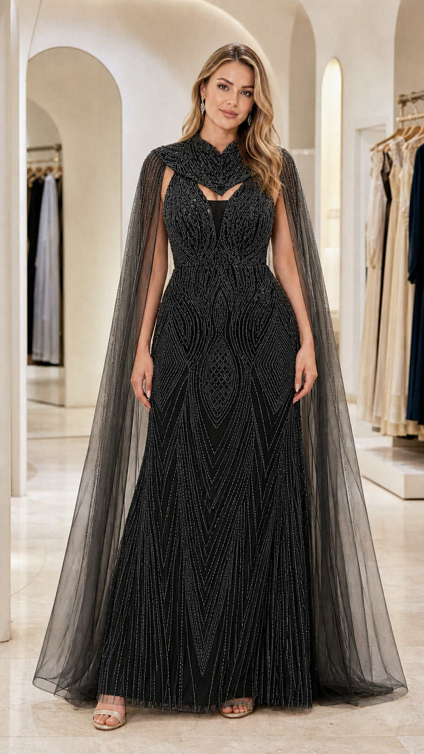 Black beaded cape evening gown with sparkling embellishments and illusion neckline