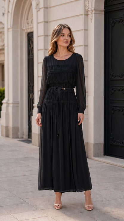 Front view of model wearing black pleated long-sleeve maxi dress