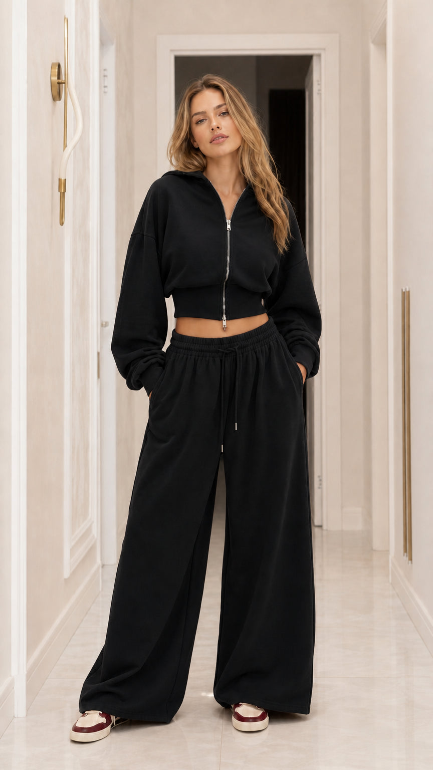 Front full-length view of black cropped zip-up hoodie and wide-leg sweatpants set