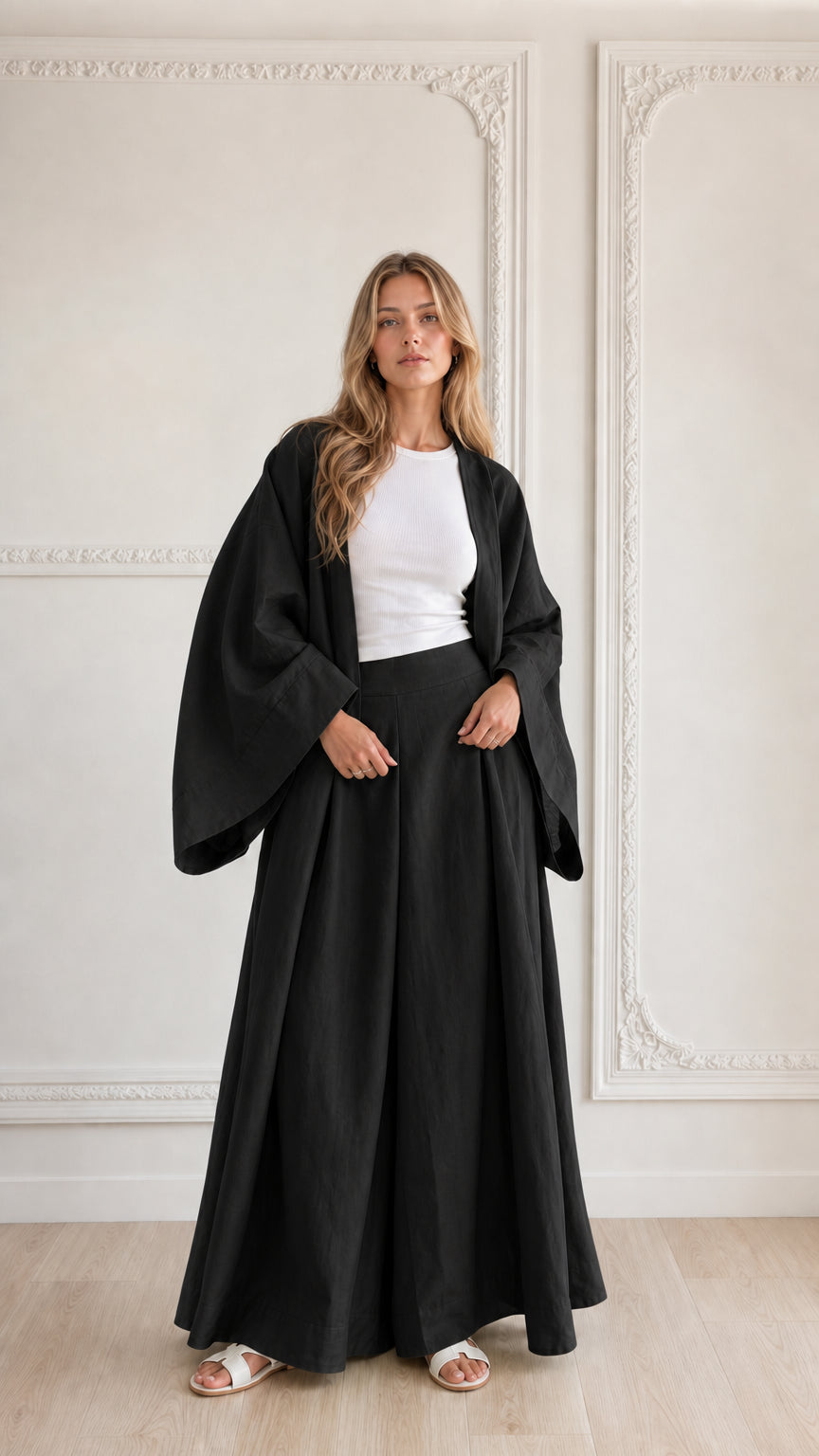 Full-length view of woman wearing classic black 2-piece kimono cardigan and wide leg set