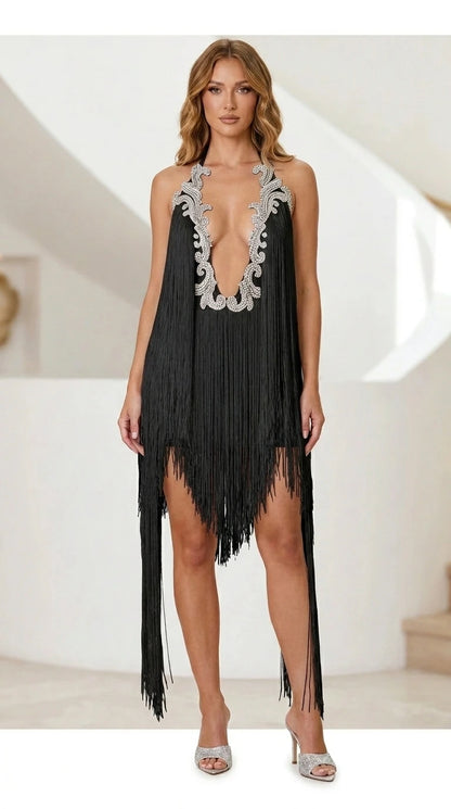 Model wearing black fringe halter mini dress