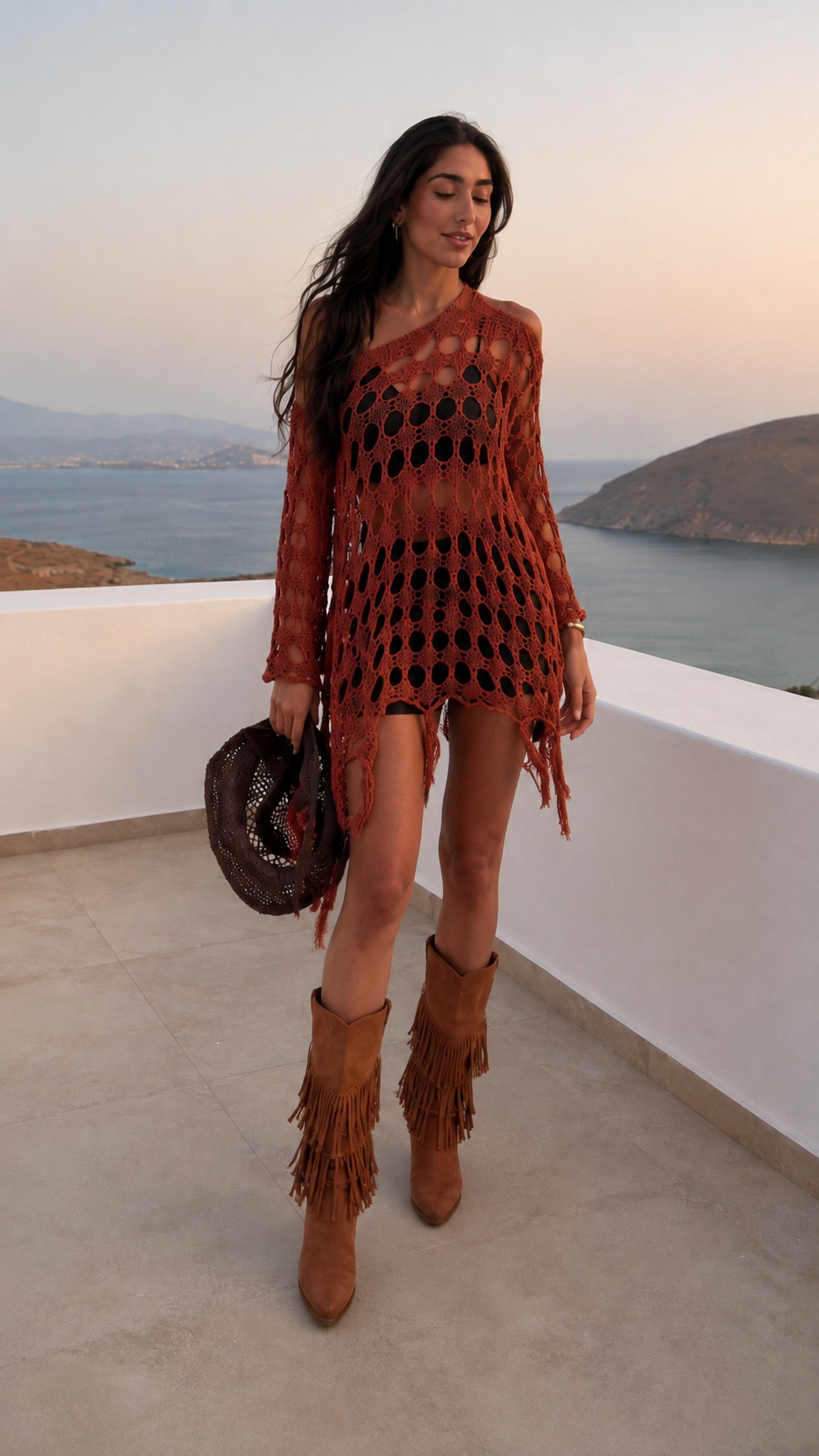 Woman wearing rust orange boho fringe open-knit tunic