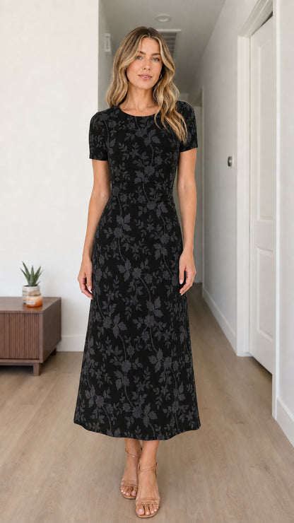 Woman wearing black floral midi dress