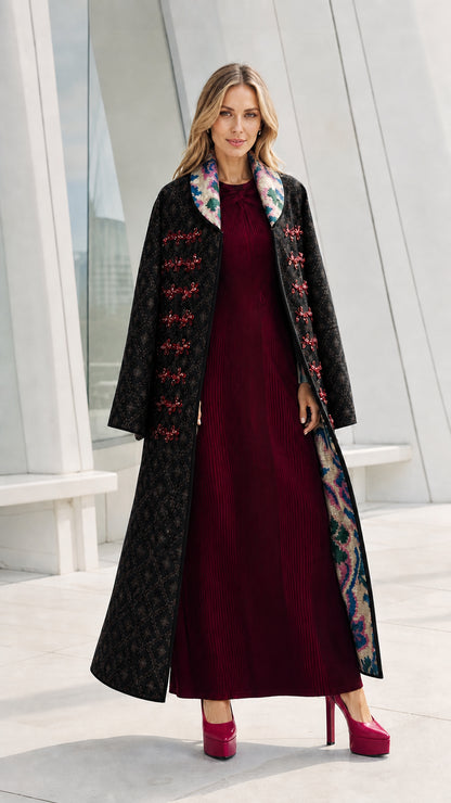 Model wearing the black variant of the quilted long coat