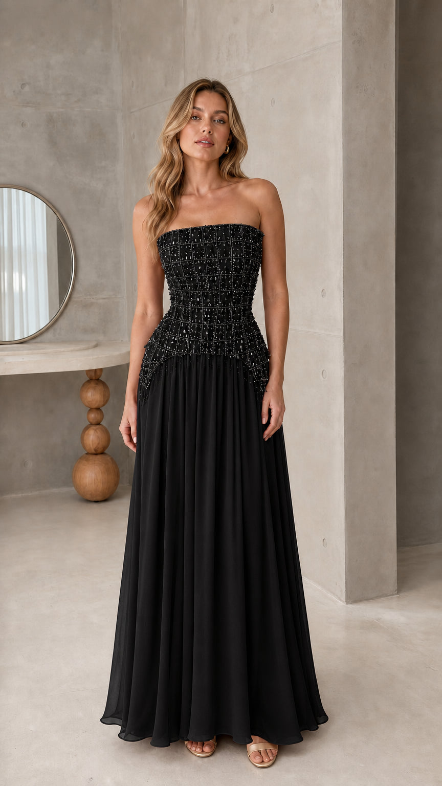 Front view of strapless black beaded corset formal maxi gown