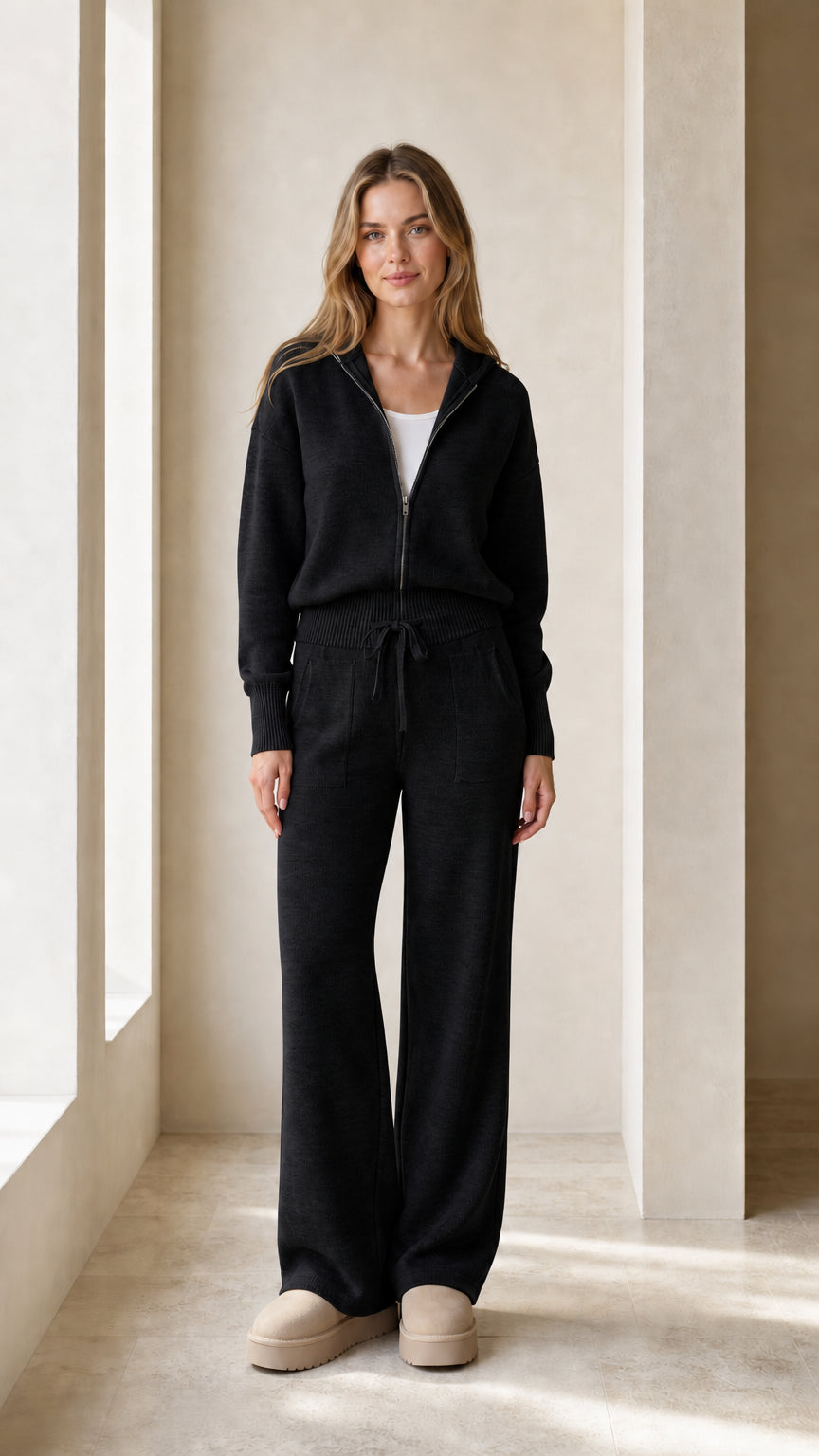 Front view of the black women's zip-up hoodie and wide-leg jogger set