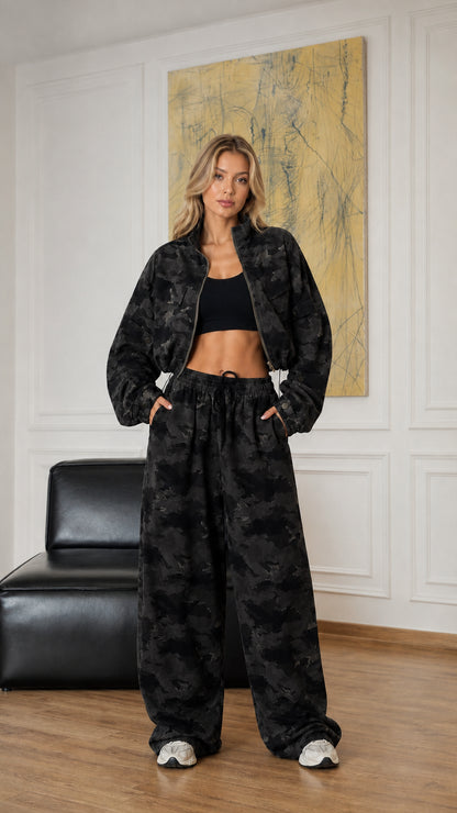 Model wearing charcoal black camouflage cropped jacket and wide-leg pants set