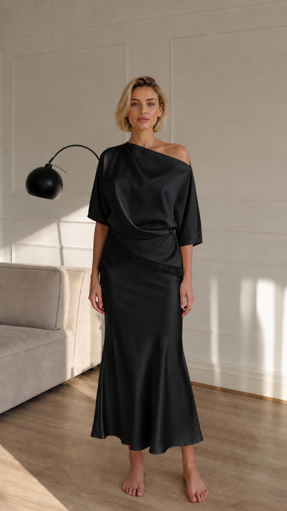 Woman wearing black satin two-piece set