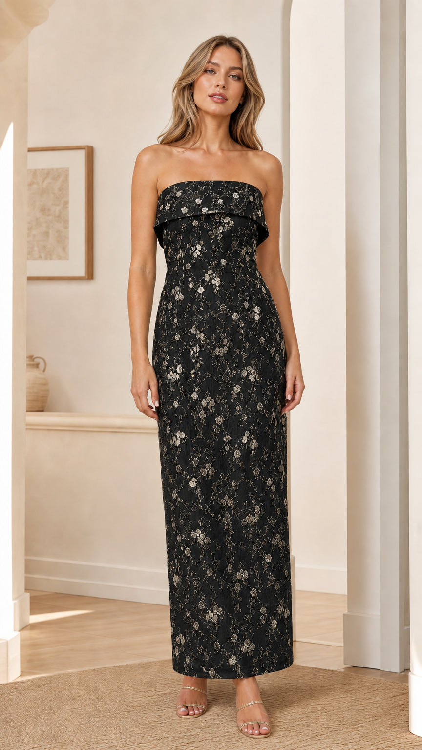 Model wearing black strapless floral embroidered maxi dress