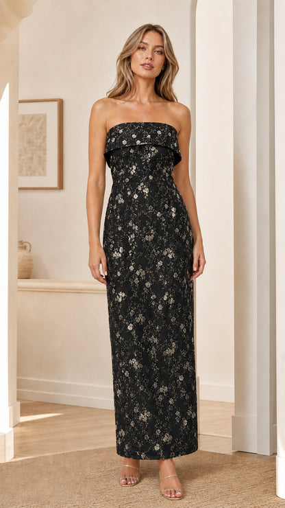 Model wearing black strapless floral embroidered maxi dress