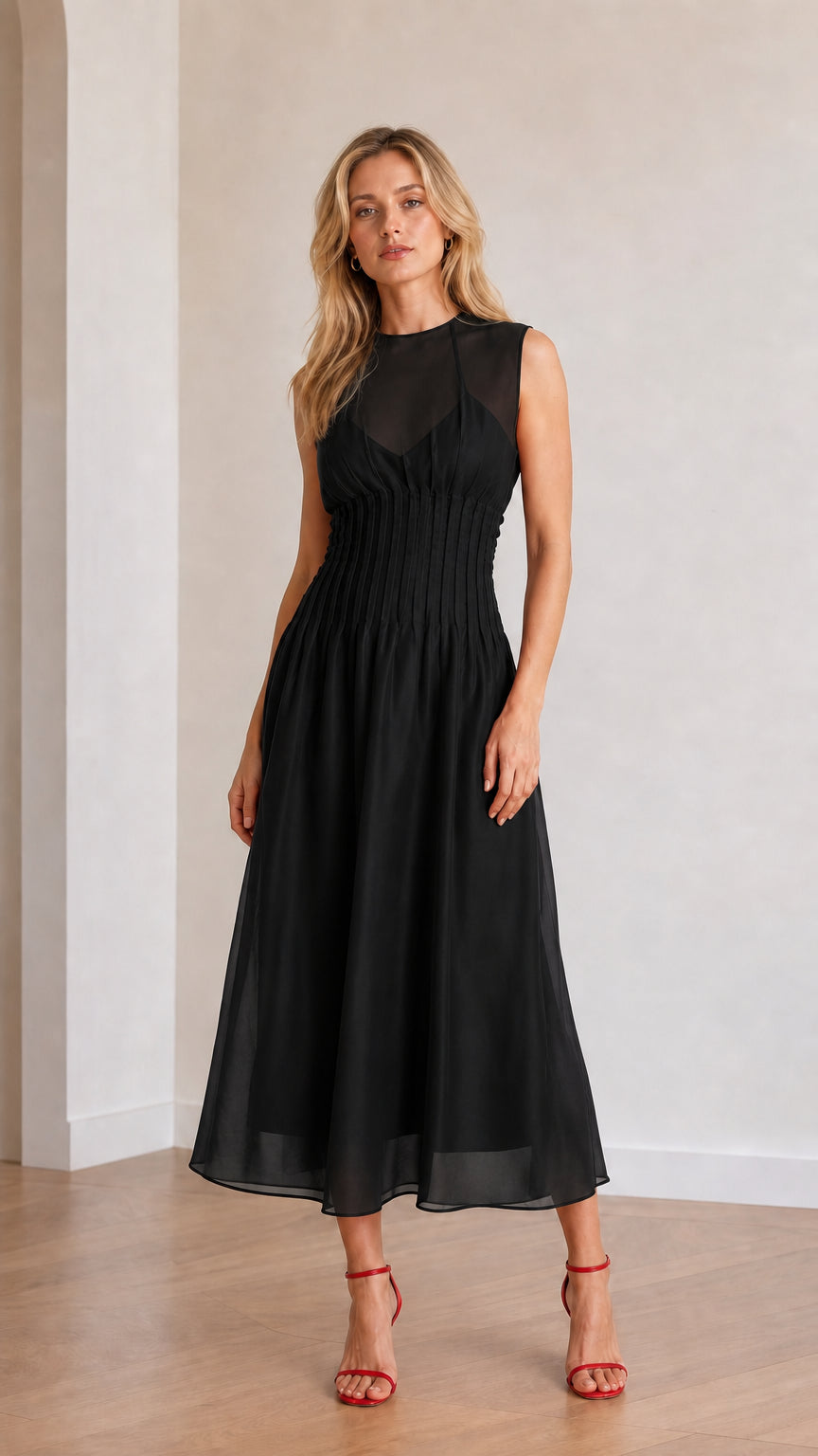 Front view of model wearing black sleeveless midi dress