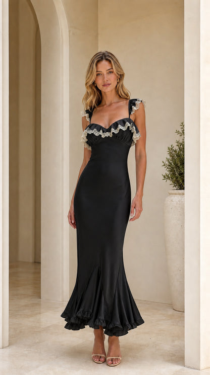 Model wearing black ruffle trim maxi dress