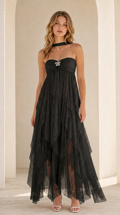 Model wearing black strapless tulle maxi dress
