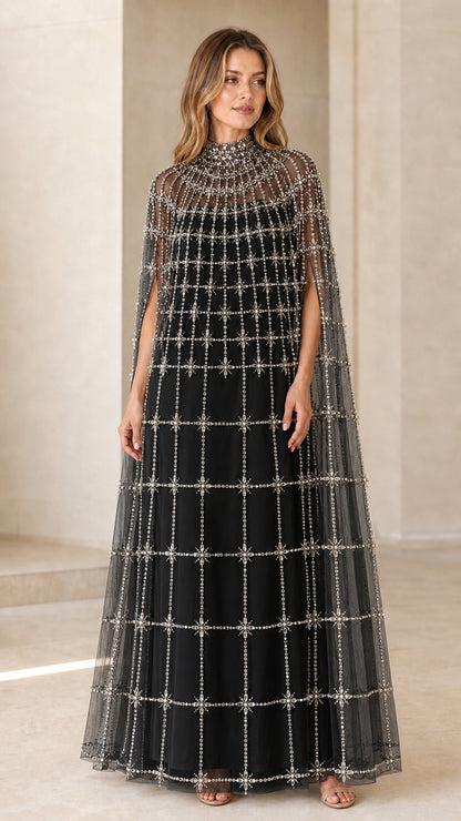 Front view of model wearing Black high neck beaded cape evening gown
