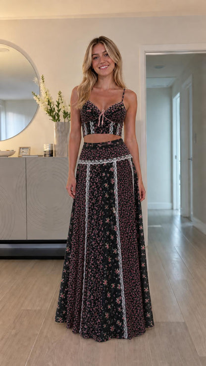 Model wearing black multi floral patchwork two-piece set