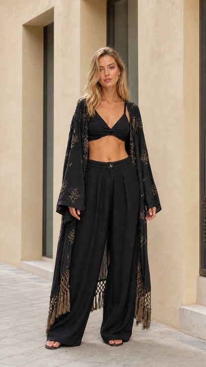 Full front view of woman wearing black embroidered fringe maxi kimono cover up