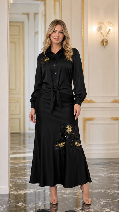 Front view of black satin blouse and maxi skirt set