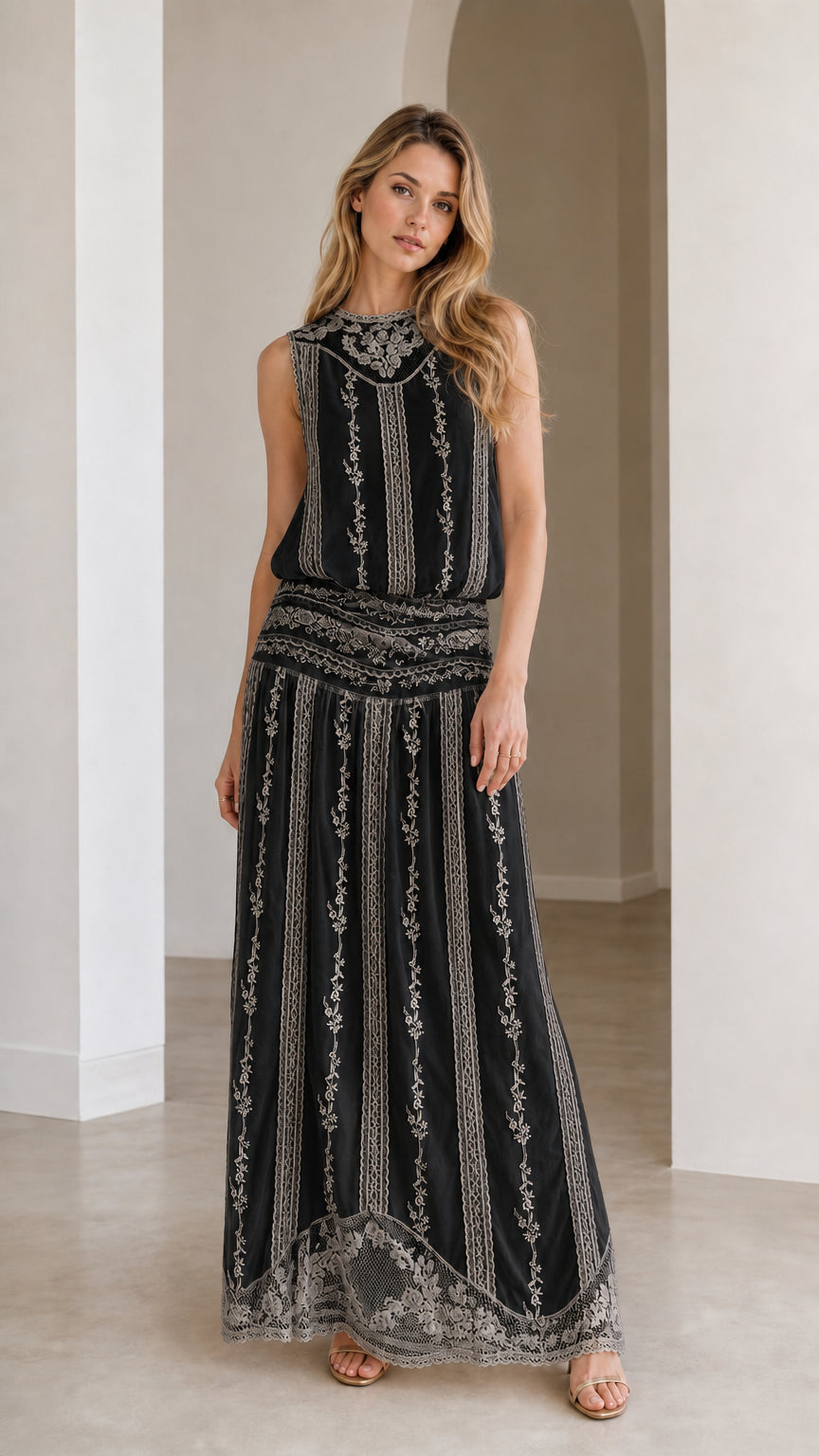 Woman wearing black floral embroidered lace maxi dress