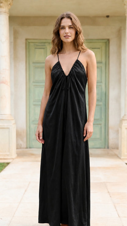 Model wearing black spaghetti strap maxi dress