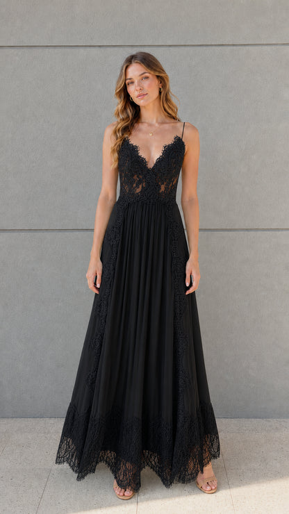 Full-length front view of black lace bodice pleated tulle maxi dress