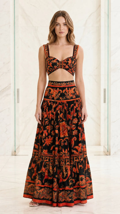 Woman wearing black and orange baroque print two-piece set