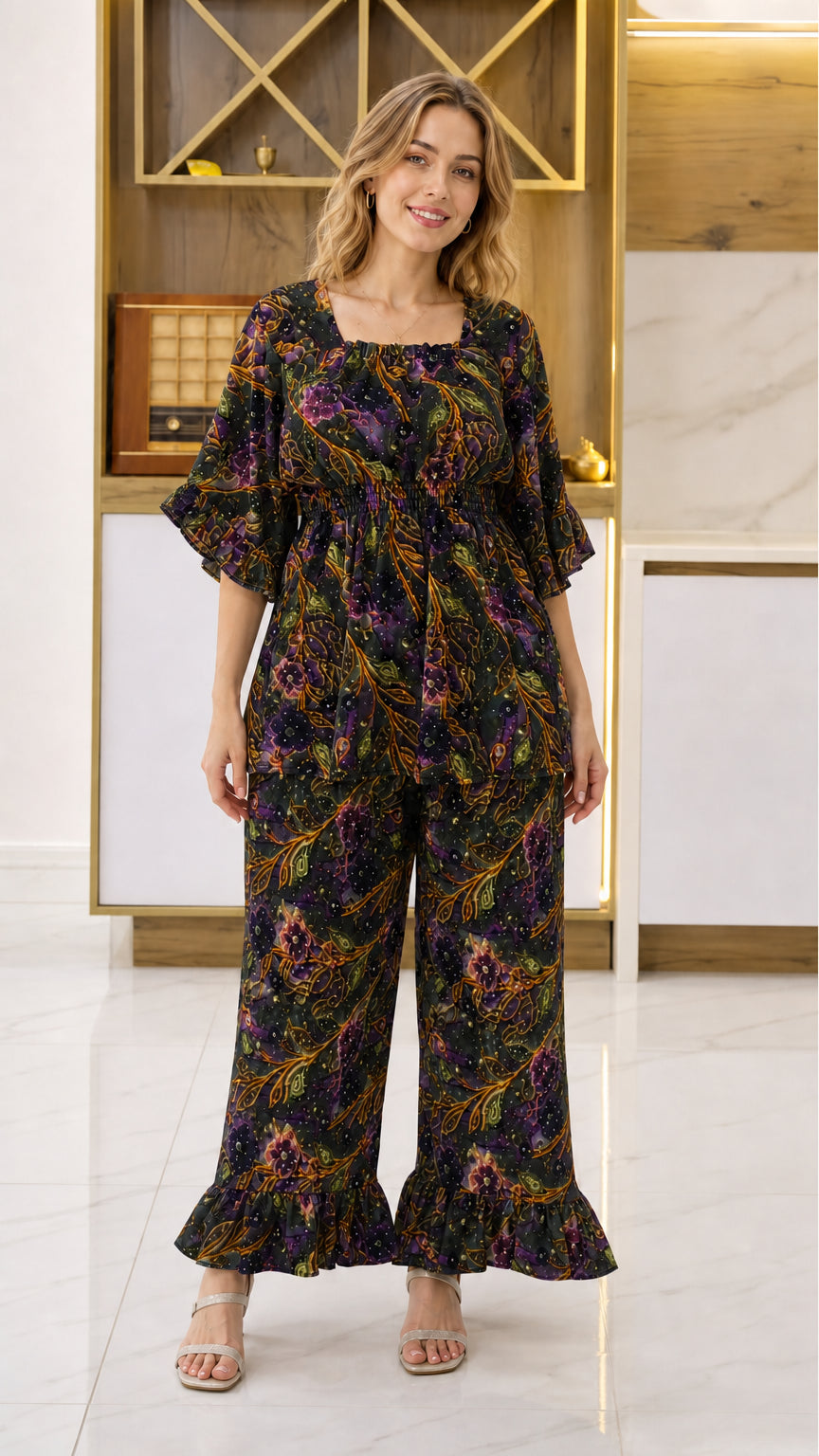 Front view of woman wearing Black multicolor floral smocked top and wide-leg pant set