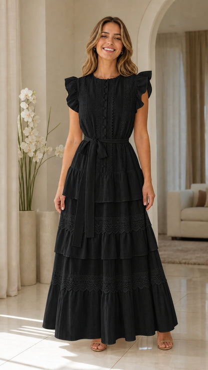 Woman wearing black ruffle sleeve tiered maxi dress