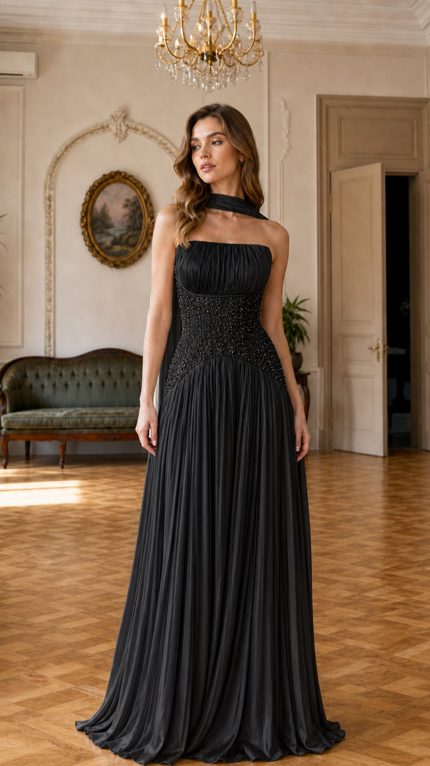 Black pleated chiffon evening gown with beaded corset waist and neck drape
