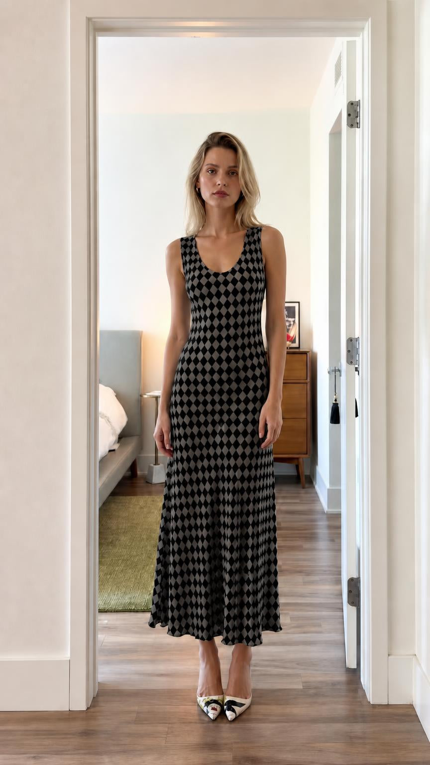 Front view of model wearing black argyle dress