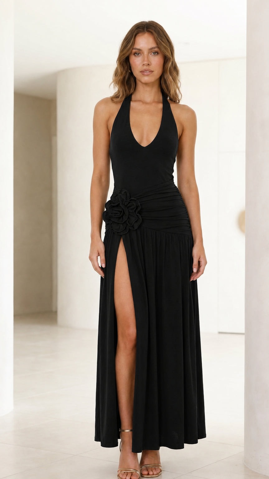 Front view of model wearing black halter neck maxi dress